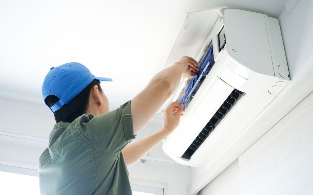 HVAC technician servicing a ductless mini split in Culver City
