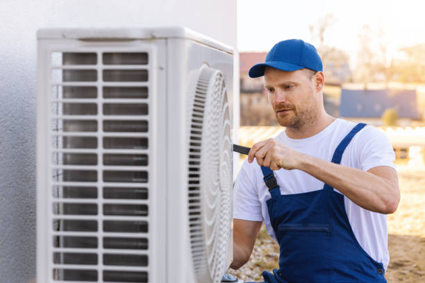 HVAC technician servicing an outdoor air conditioner in Culver City