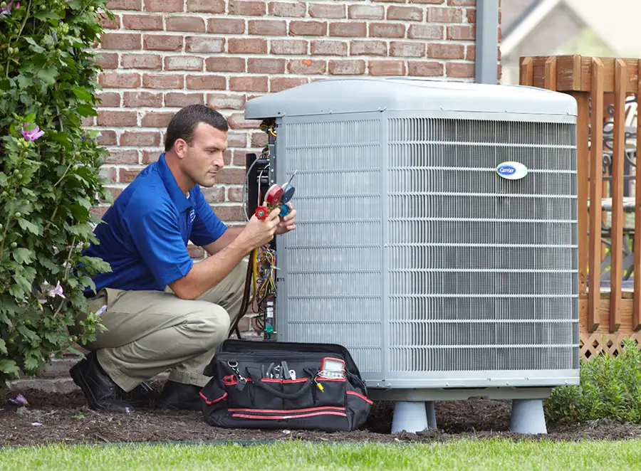 HVAC technician inspecting an outdoor AC unit in Culver City