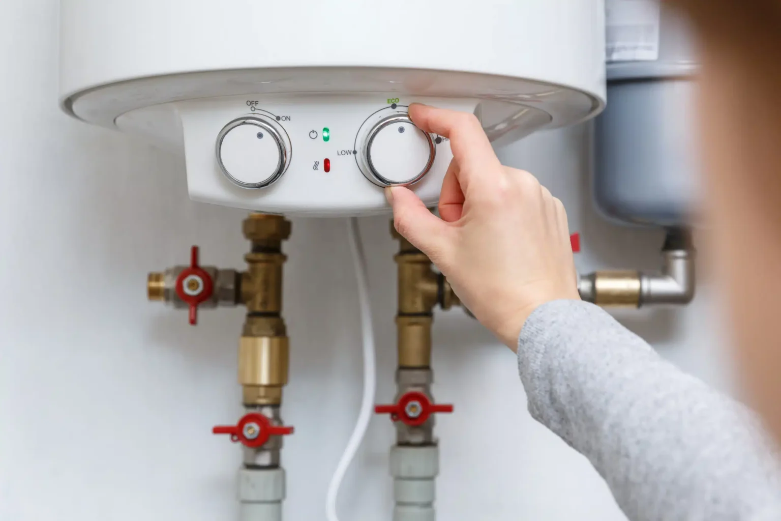 Technician adjusting a water heater in Culver City